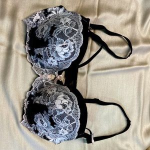 VS black/cream lace with silver accent.  Size 32D